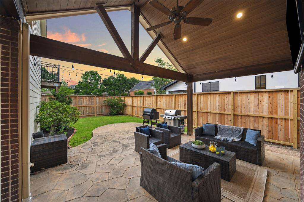 OUTDOOR LIVING.  A HUGE covered patio!  Enjoy outdoor living rain or shine!