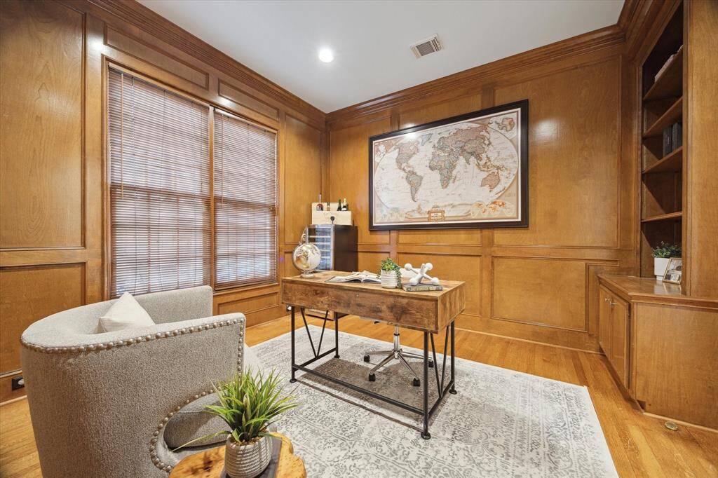 STUDY.  Located in the middle of the home, we left the traditional wood paneling unpainted but it would be easy to paint your favorite color.  Imagine a bottle green, matt grey or a steely blue.