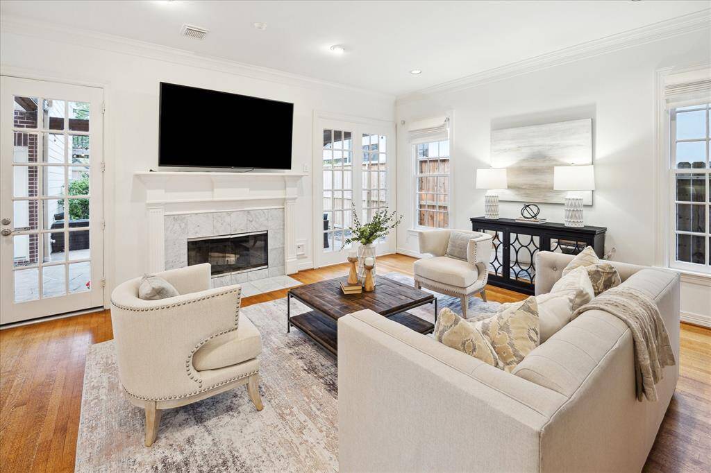 FAMILY ROOM.   With double patio doors and windows all around, the family room is a sunny, welcoming space with easy access out onto the patio.