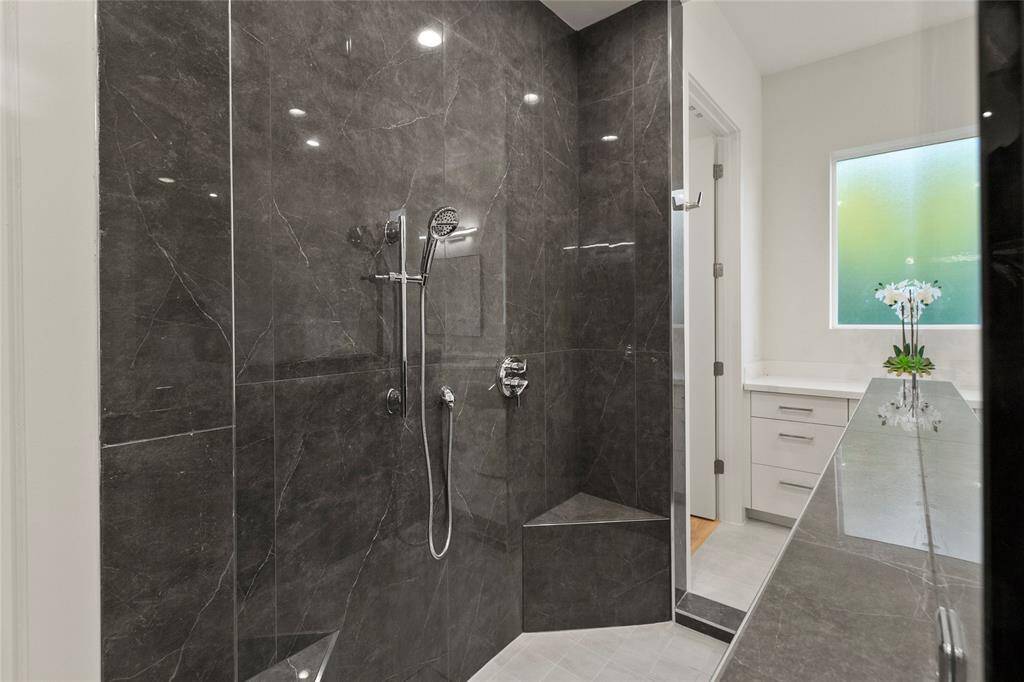 Luxury primary bathroom with double entry shower