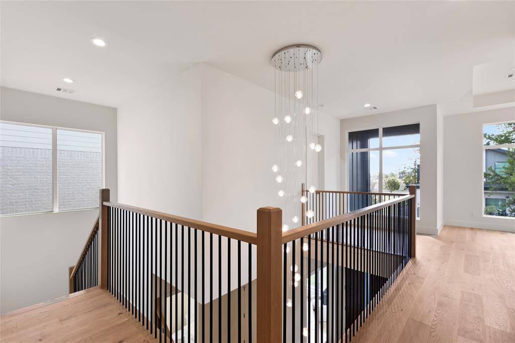 Top down view of the entry way with this unique and luxury chandelier