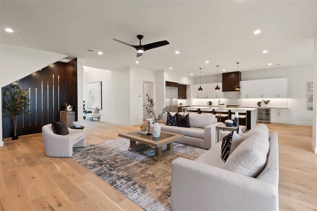 Open living area with wine wall spacious kitchen with luxury Thermador appliances