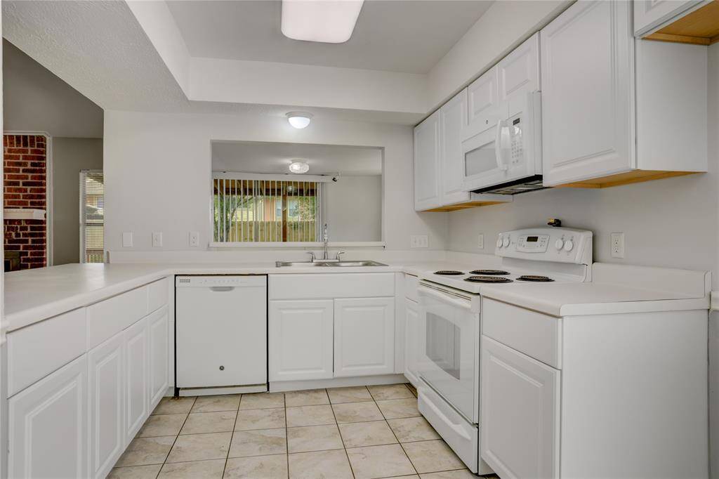 This kitchen is spacious and has all the counter and cabinet space you need!