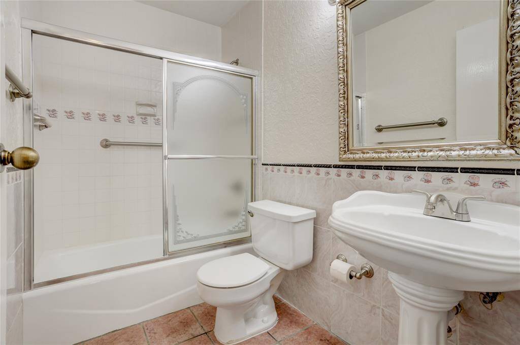 The secondary bath is spacious and elegantly designed.