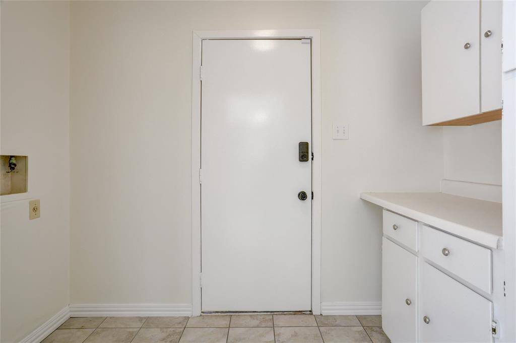 The laundry room has tons of storage and is inside the home.