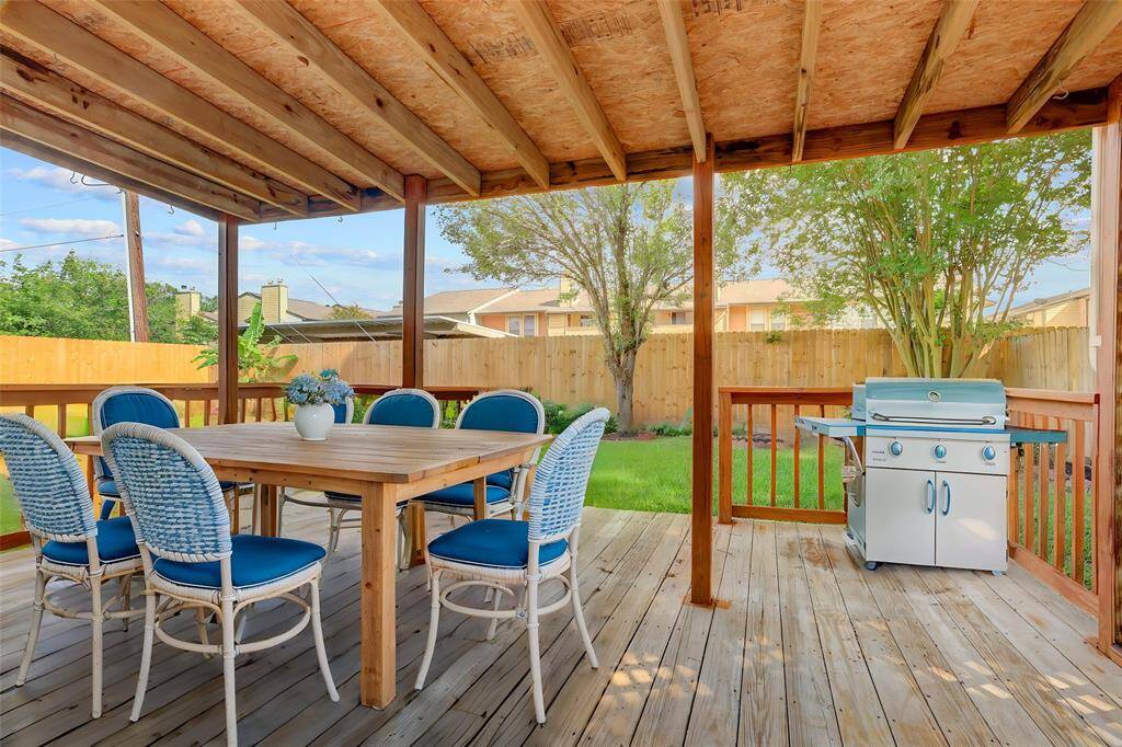 As you enter the back yard through the sliding glass doors, you are greeted with a lovely covered porch.