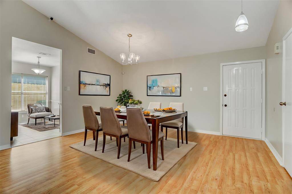 The large nook off the living and entryway is virtually staged as a formal dining room, but would also make a great library or game room area.