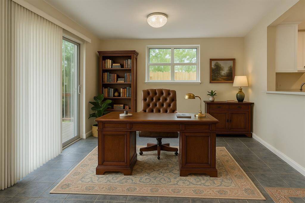 This room off the kitchen and leading to the back patio has been virtually staged to show you the possibility of it being used as a lovely office space.