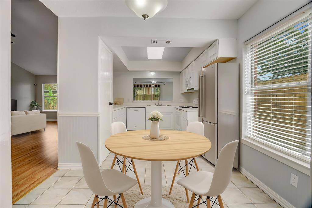 As you enter the kitchen, you have a lovely virtually staged breakfast area.