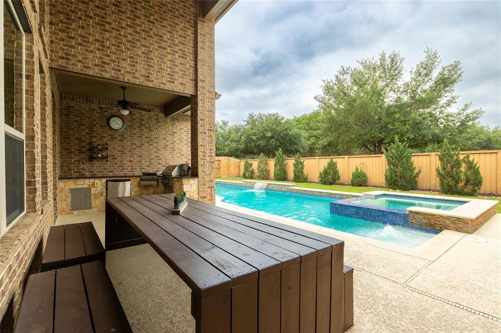 Covered patio and outdoor kitchen.