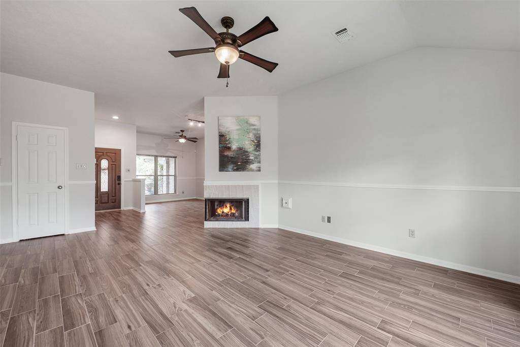 Lighted ceiling fan & chair-rail molding.