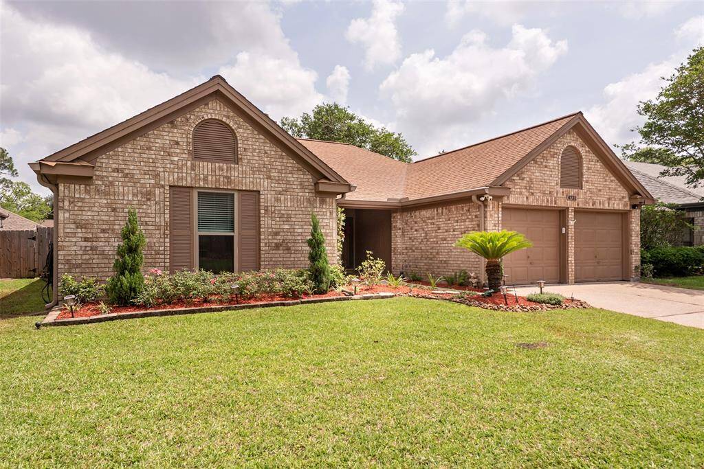 Beautiful outside and in! Nicely manicured lawn with attractive landscaping.