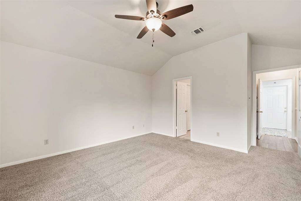 Primary bedroom - lighted ceiling fan.
