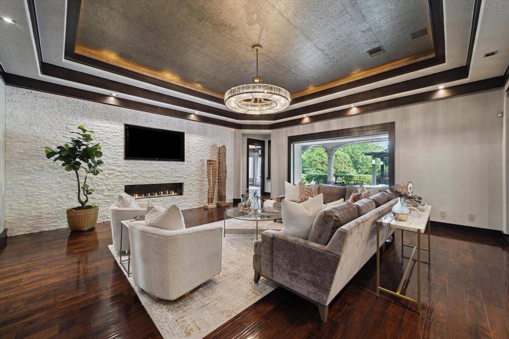 The interior of the home was envisioned by renowned Miami-based contemporary designer Adriana Hoyos. Her carefully curated modern aesthetic elevates luxurious indoor living while effortlessly blending the outdoors in through expansive, uninterrupted picture windows found across the residence. The thoughtfully proportioned layout accommodates substantial furnishings with ease, offering the perfect setting for both relaxed evenings and sophisticated entertaining.