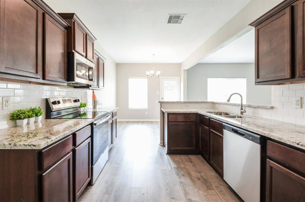 VIEW OF THE KITCHEN FROM PANTRY