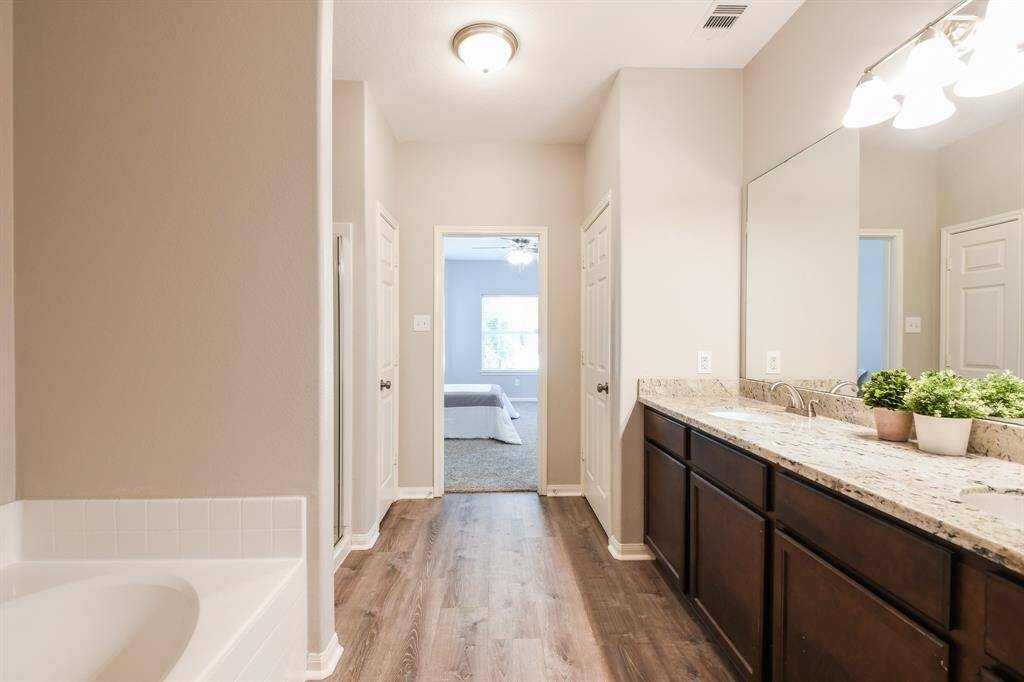 PRIMARY BATHROOM WITH 2 SINKS, TUB AND SHOWER