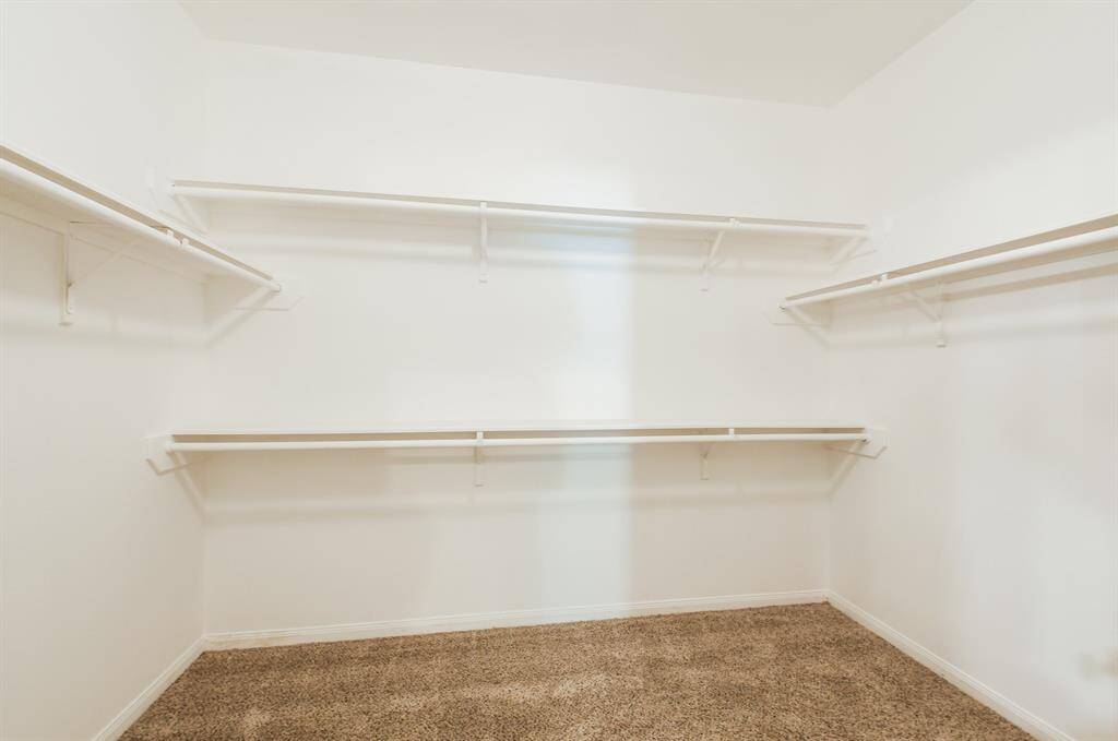 PRIMARY SPACIOUS WALK-IN CLOSET