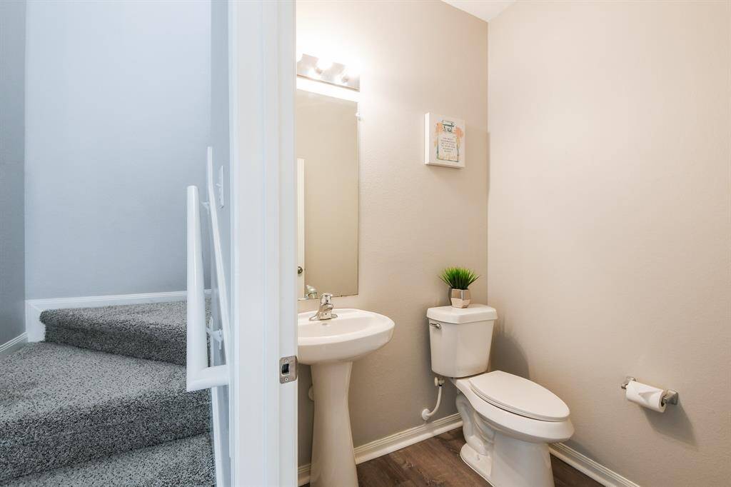 POWDER ROOM BY THE STAIRCASE DOWNSTAIRS