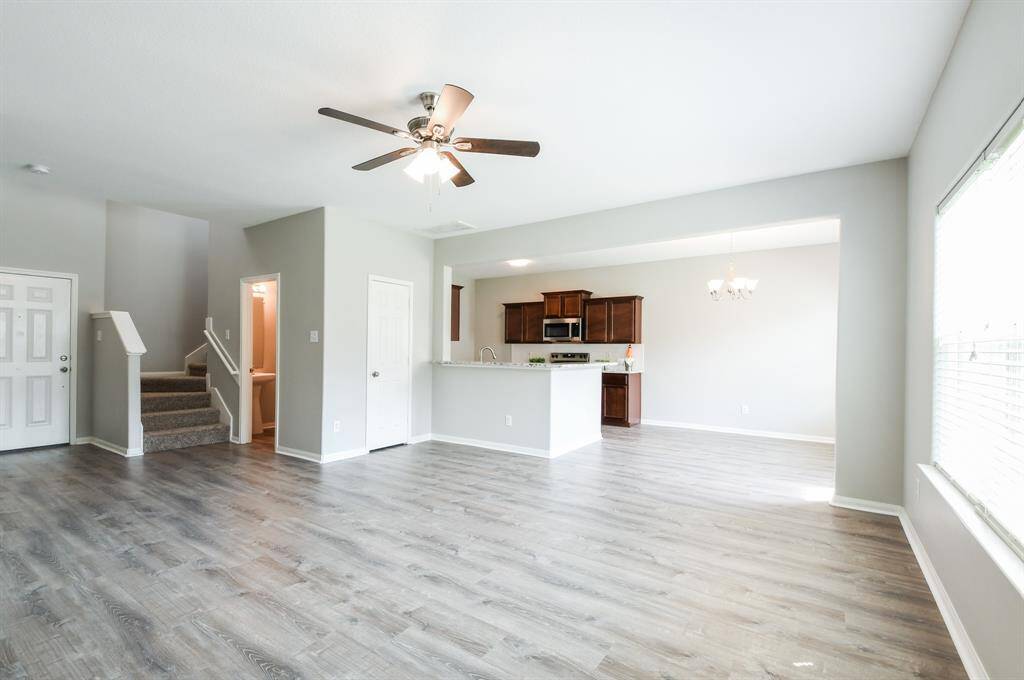 STAIRCASE AND HALF-BATH ARE LOCATED BY THE FRONT ENTRANCE.