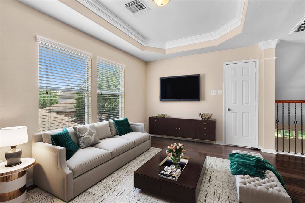 Upstairs, you can unwind and relax in the spacious game room. The tray ceiling with crown moulding provides an elevate aesthetic to this causal space. Whether you are looking for a secondary living room, play room or study, this flex space can provide that functionality for you without sacrificing style.  TV mount to convey with property.