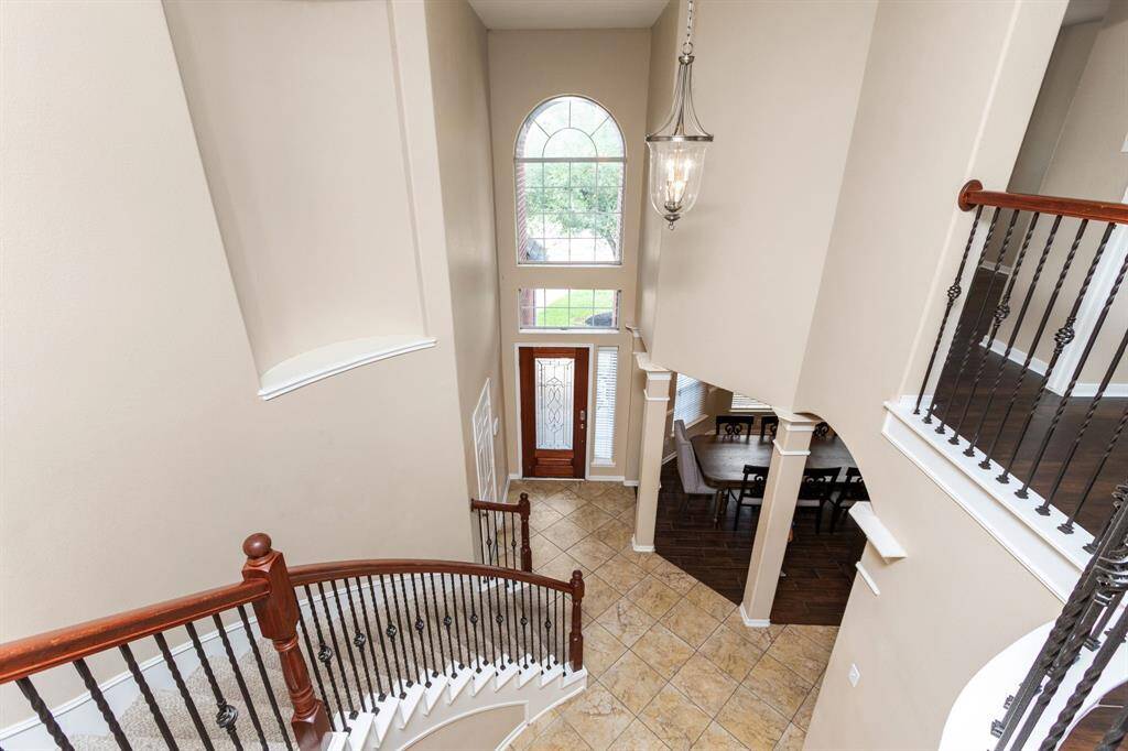 View from the upstairs walkway into the two-story entry foyer.