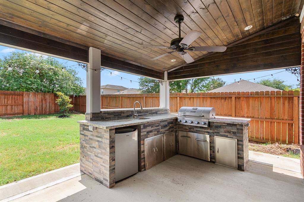 The summer kitchen is just waiting for you to fire up the grill and enjoy a cool beverage!