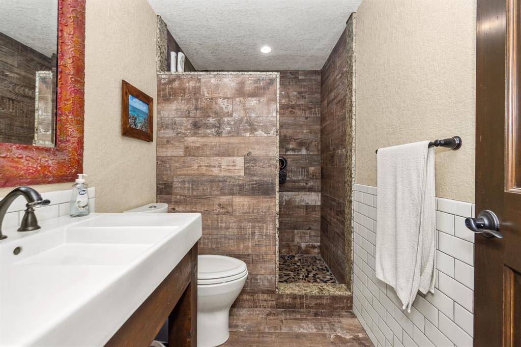 Guest bathroom with beautiful walk in shower and stylish sinks