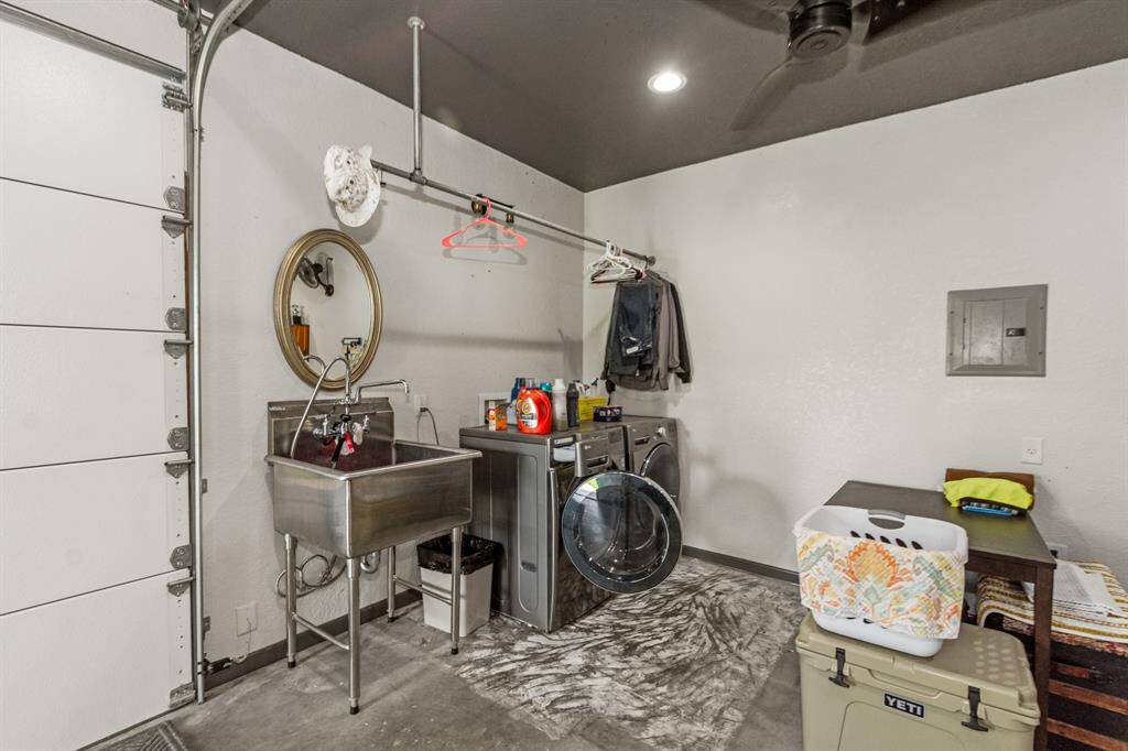 Garage in front of property houses the laundry room/wash station
