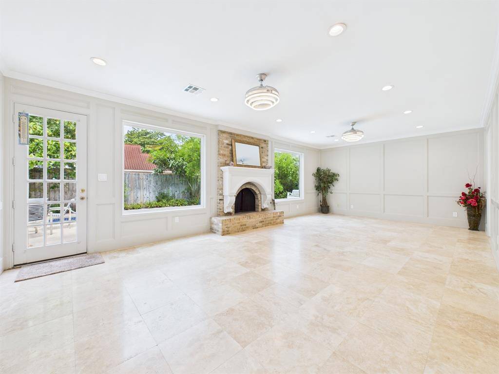 Two 5x6 Windows Flood the Family Room with Natural Lighting and Pool Views