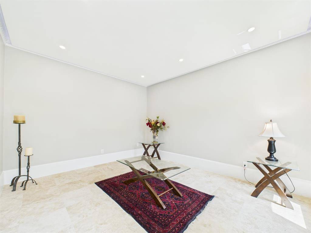 Beautiful travertine stone  Flooring, 10" Baseboards, Detailed Crown Molding, Recessed Lighting and Cove Lighting