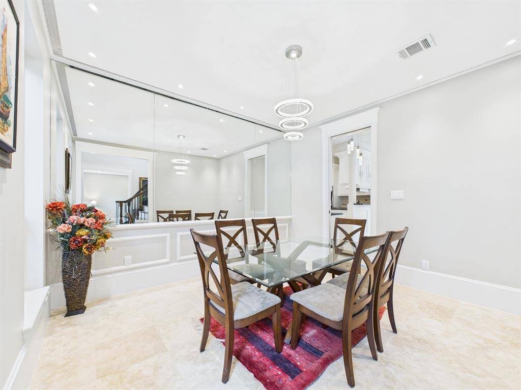 Mirrored Wall & Decorative Molding with Charming Pocket Door leading to the Kitchen