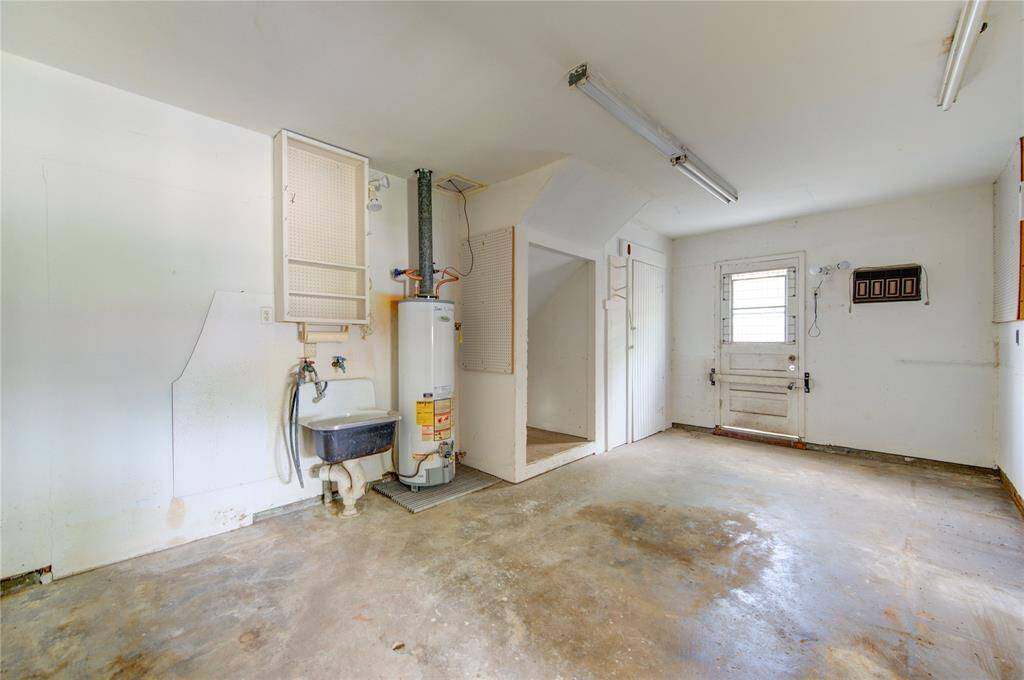 Spacious garage workroom perfect for projects and storage.