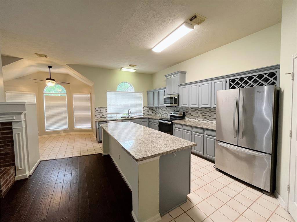 Kitchen with a Center Island, Fridge Included