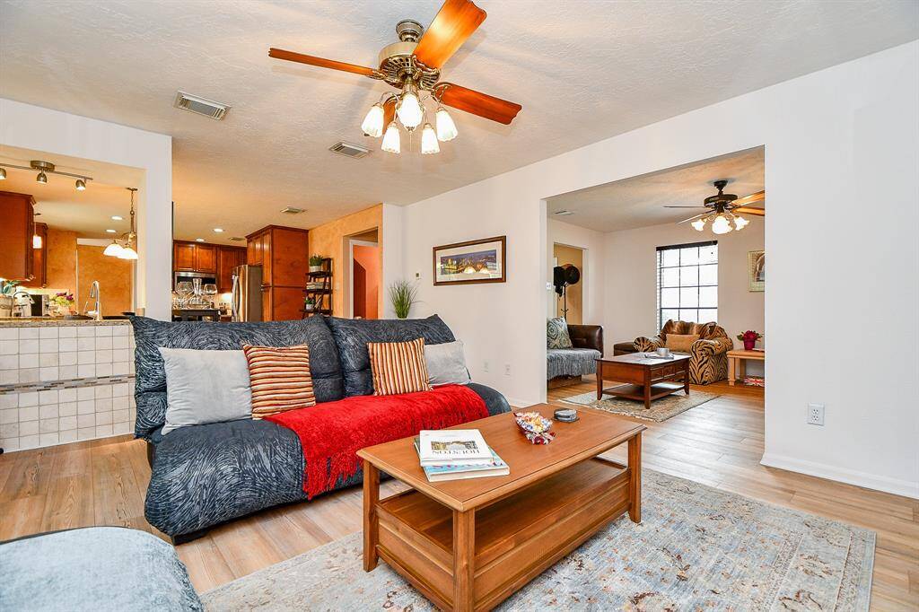 Another view of the family room that opens into the formal living room and the kitchen area.
