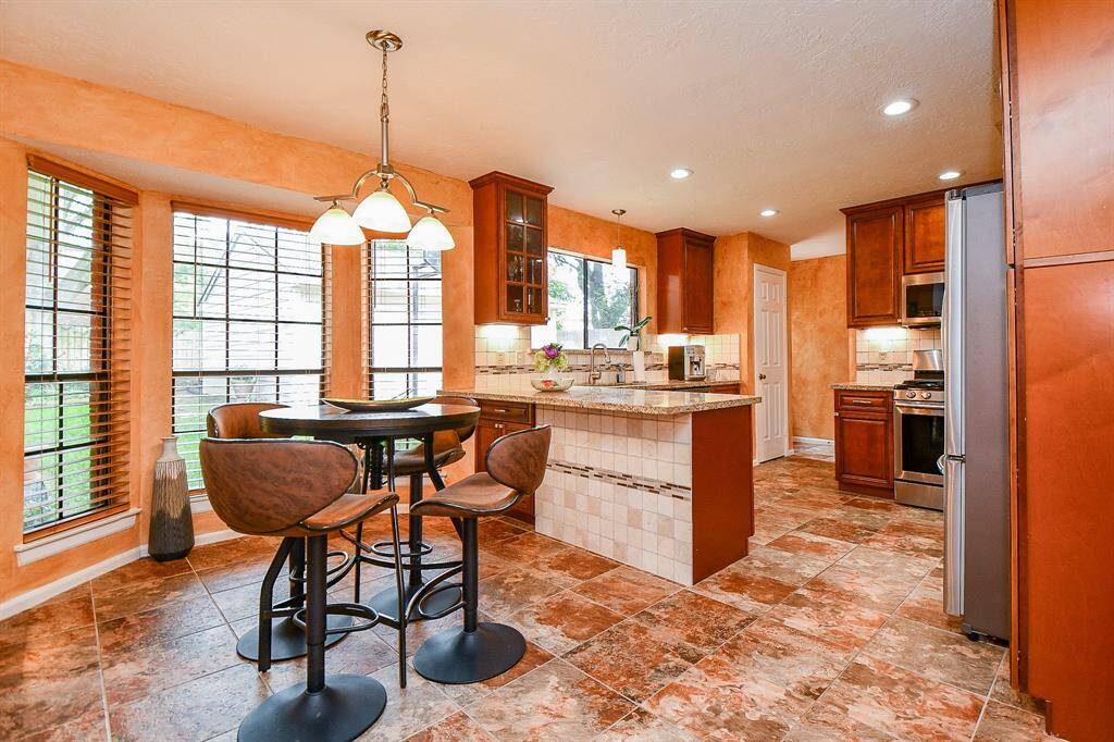 The every day breakfast nook area features a beautiful bay window.