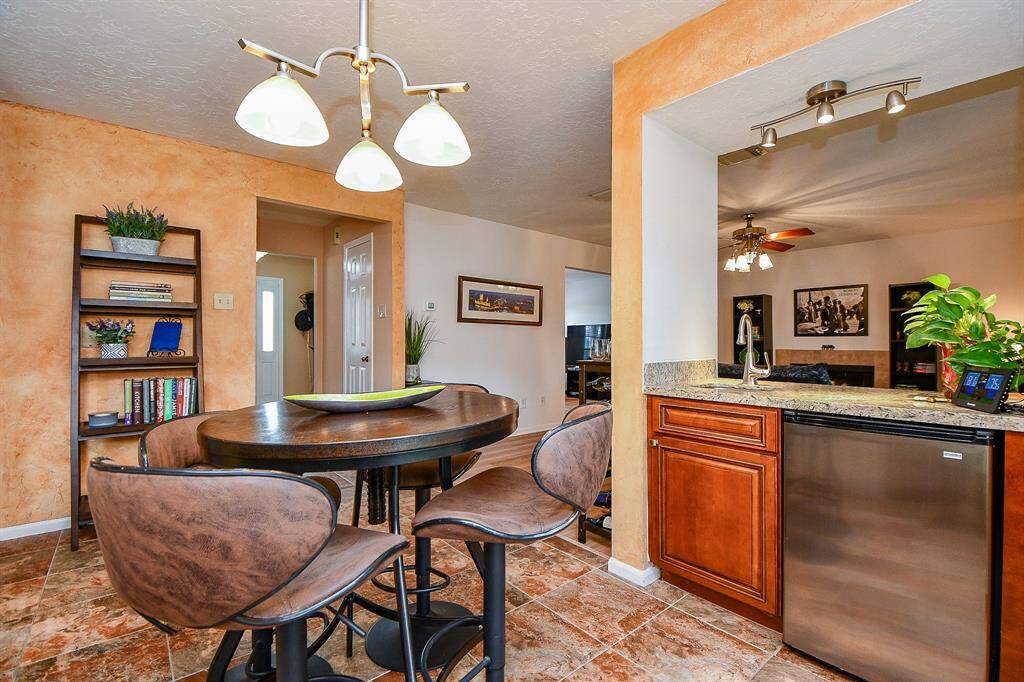 A great wet bar area separates the breakfast nook from the family room.