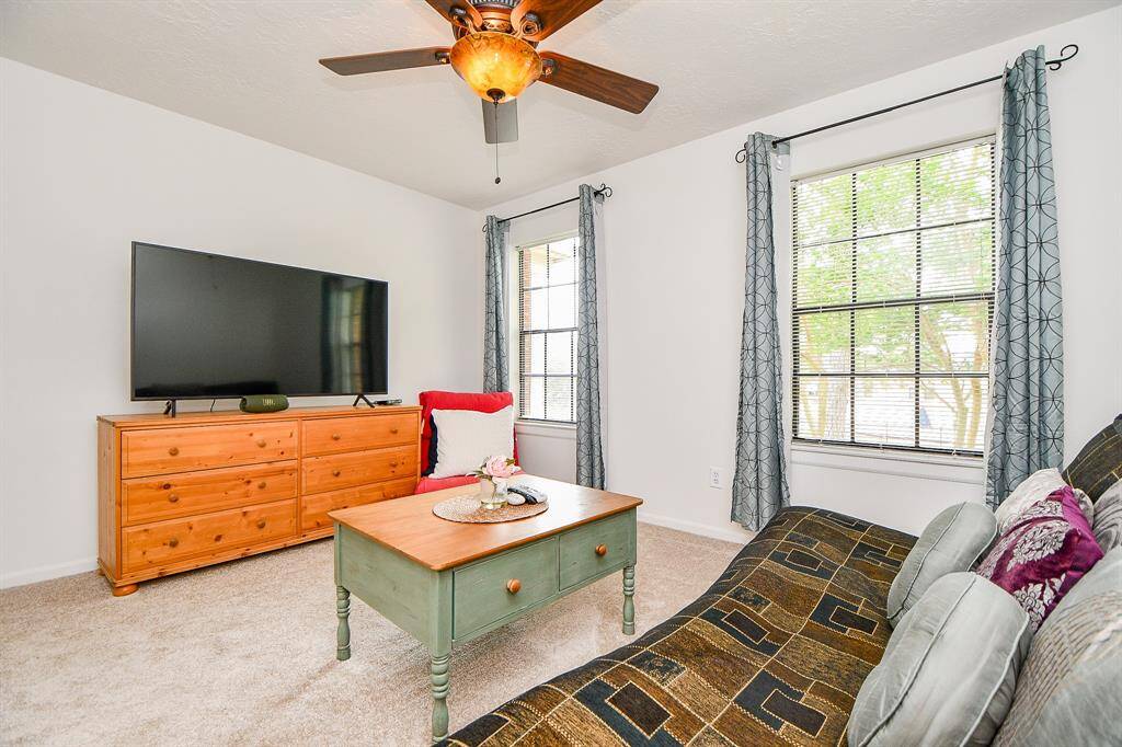 One of the upstairs bedrooms currently being used as a game room/lounge