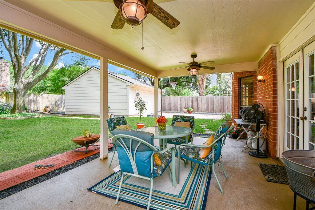 Outside you will love sitting out under your covered patio and enjoying the lush garden.