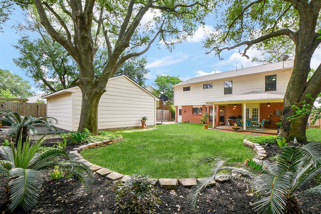 Enjoy the view of the mature trees and lush green space