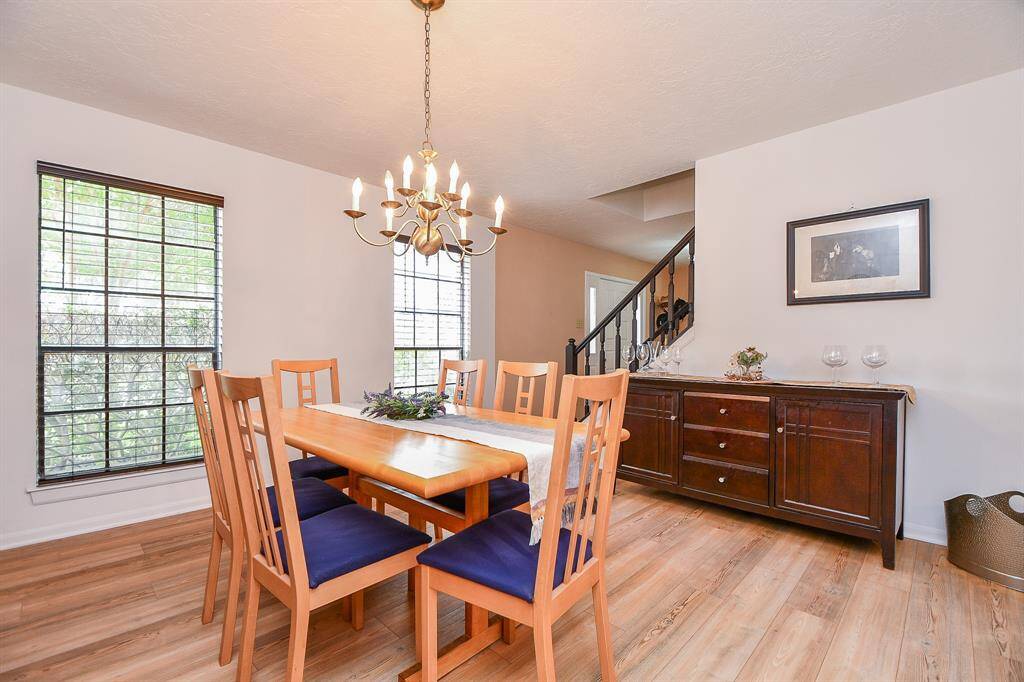 Another view of the formal dining room that features solid surface flooring.