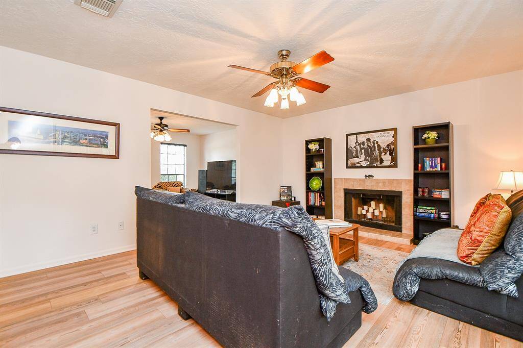 The family room features a lovely and cozy fireplace.