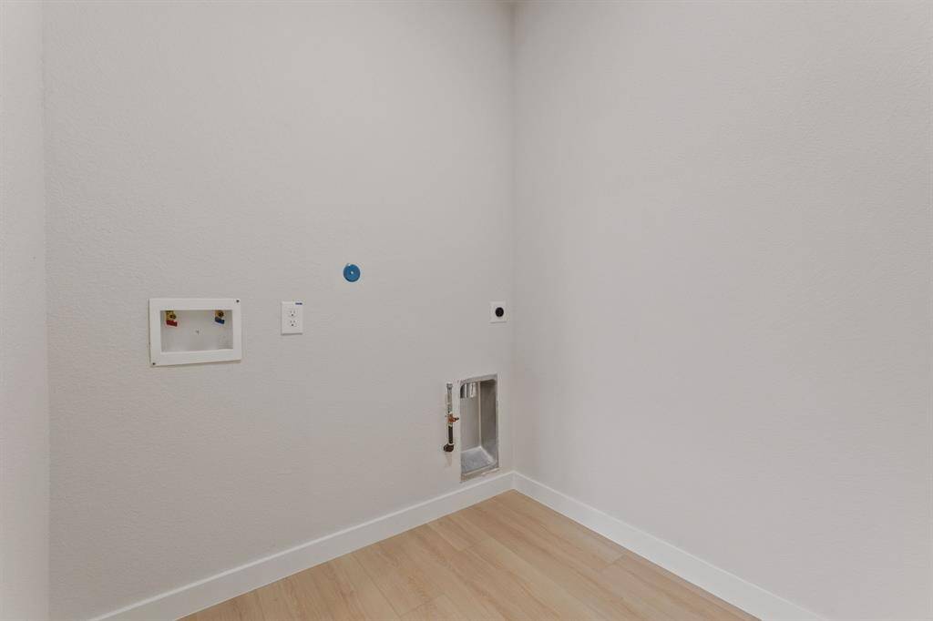 Upstairs utility room. A convenient space for laundry, keeping your home organized and efficient.