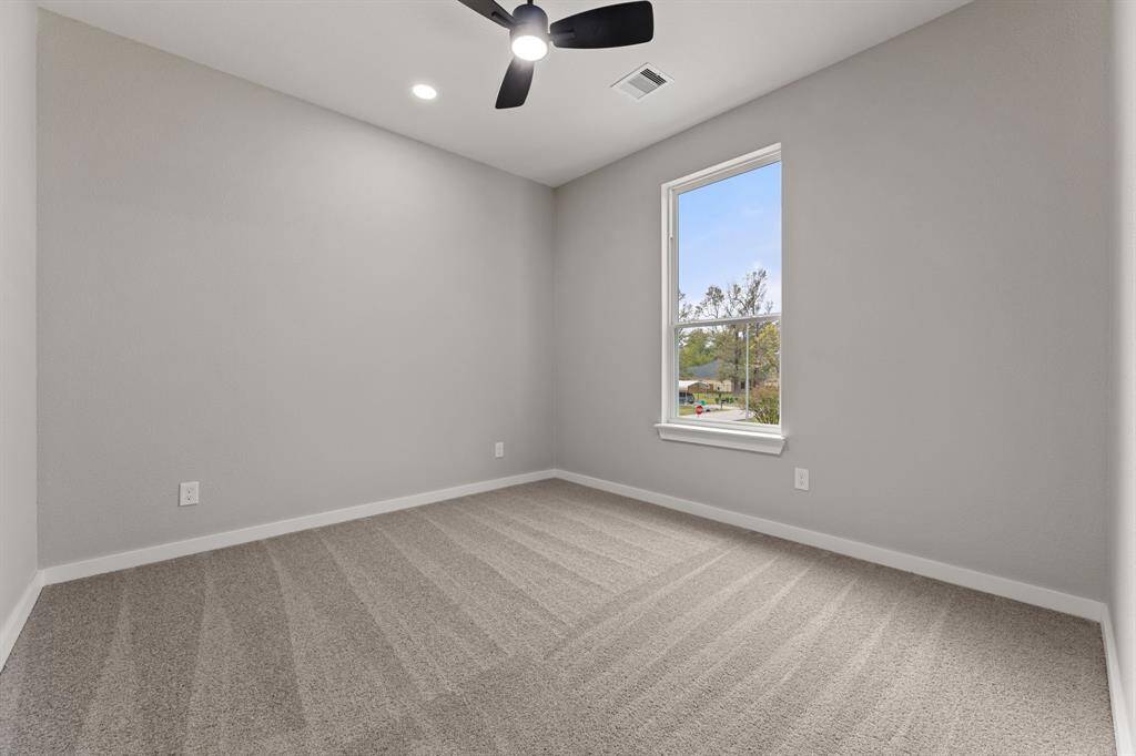 Second upstairs bedroom. Perfect for family members or as an extra guest room, offering plenty of natural light.