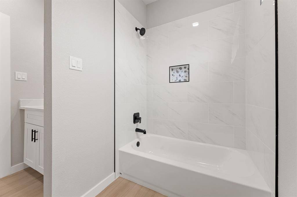 Room to grow. The upstairs full bath ensures there's no shortage of space with a tub/shower combo and separate sink area.