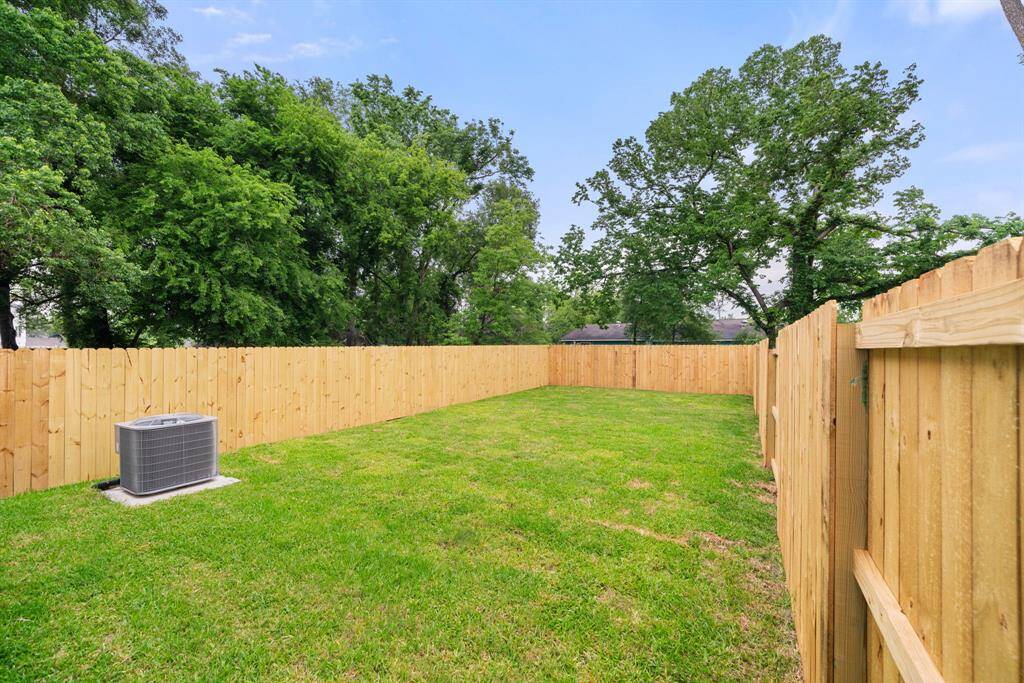 Leaving already? Well on your way out, enjoy a quick view of the backyard from the private side entrance/exit.