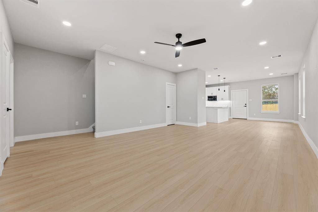 Spacious living area. Perfect for gatherings or lounging, this open living space is light-filled and ready for your personal touch.