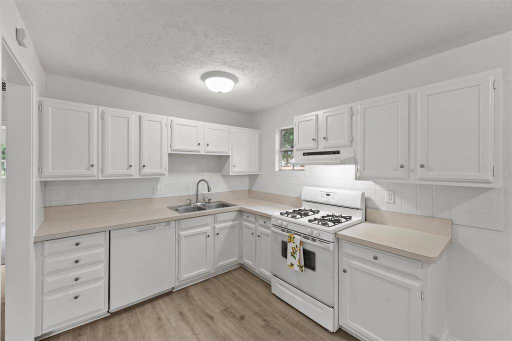Featuring a brand-new dishwasher and modern faucet for a stylish, upgraded kitchen experience.