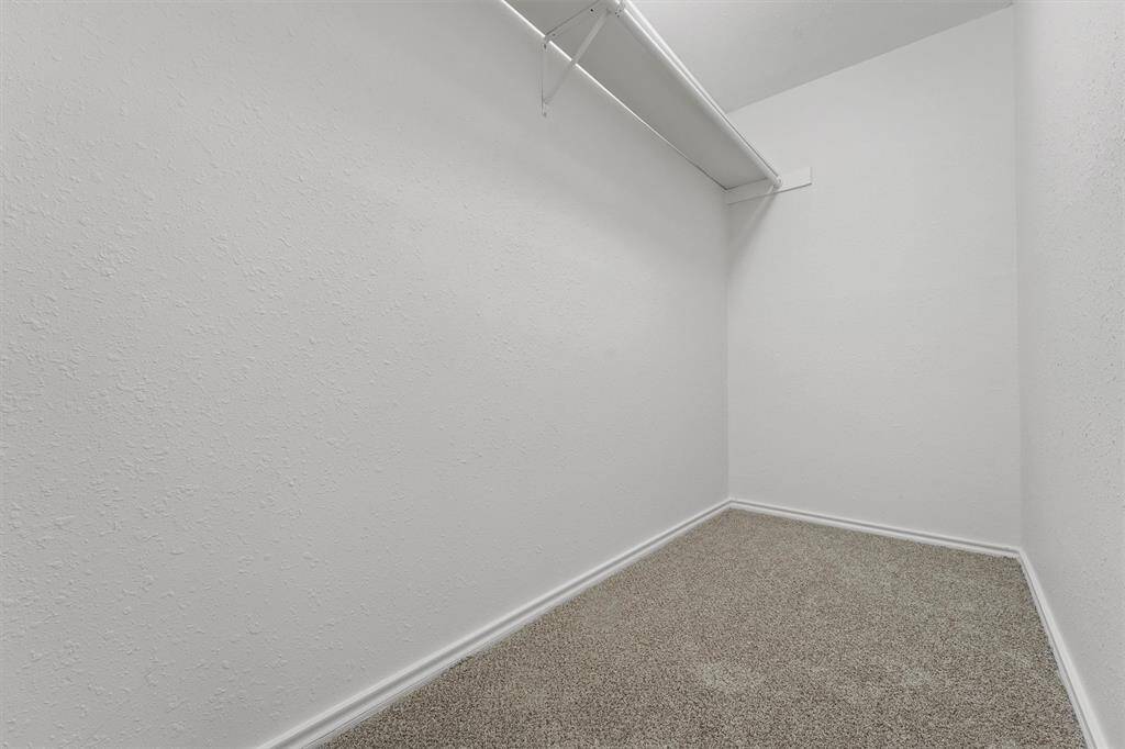 Spacious walk-in closet in the secondary bedroom.