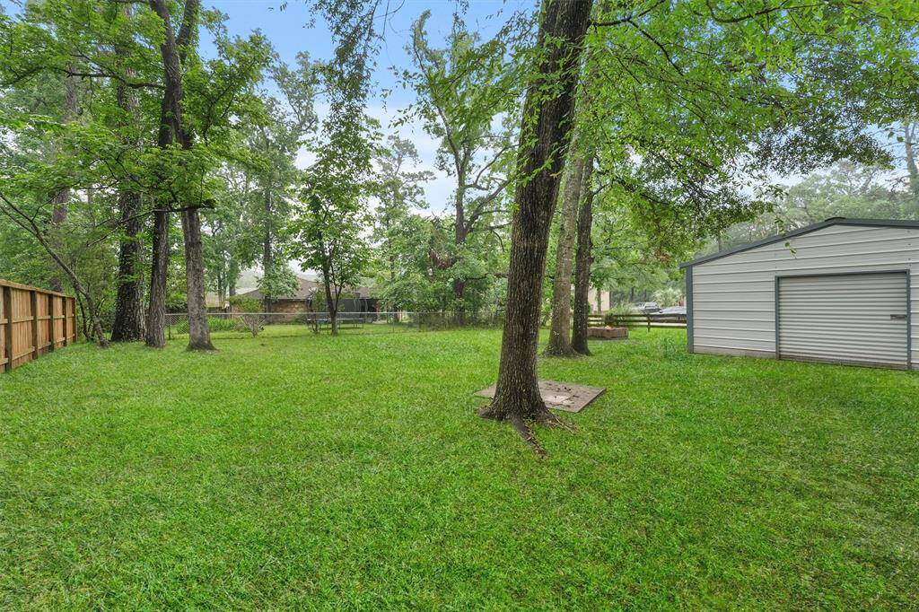 Convenient storage shed seamlessly attached to the carport for easy access and extra space.