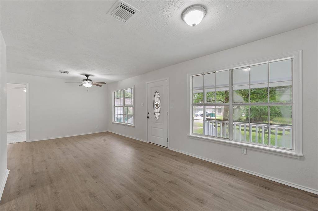 Stylish new vinyl plank flooring enhances the appeal.
